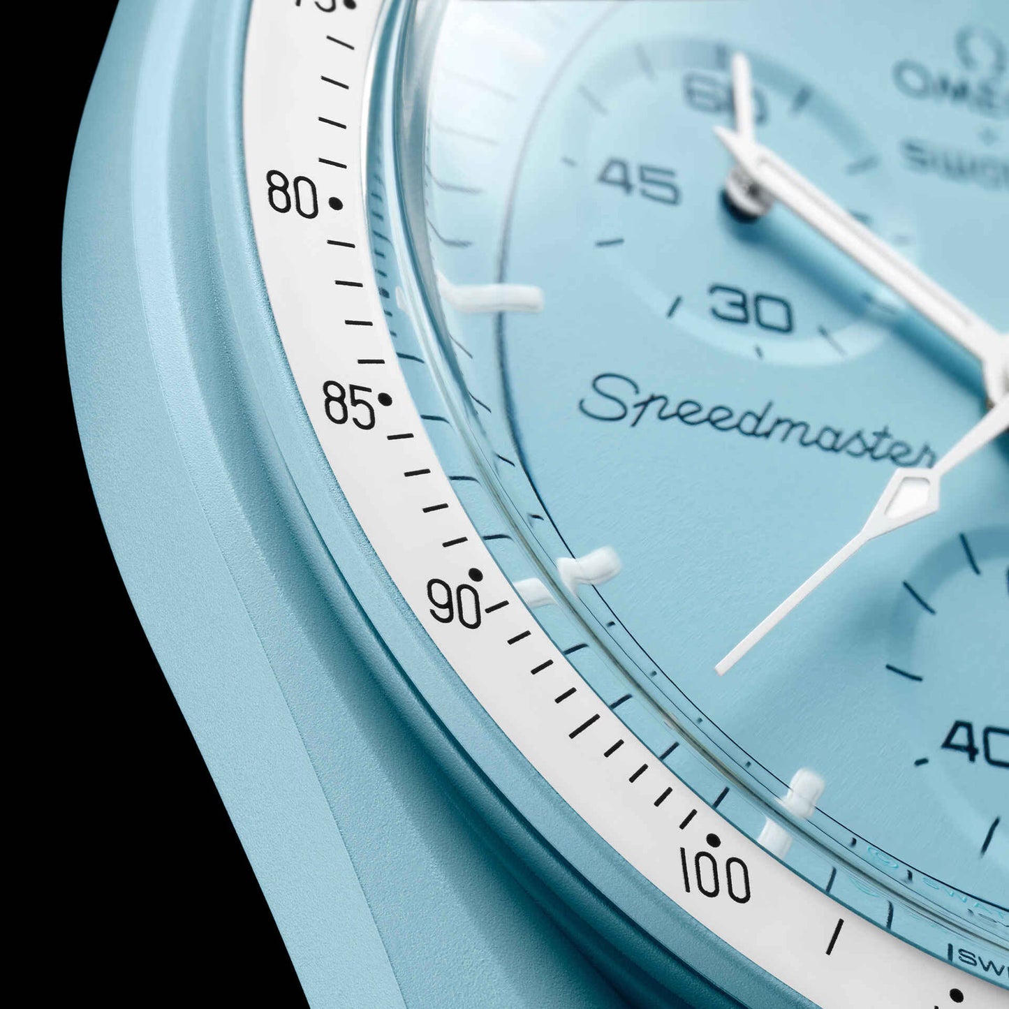 Close-up view of Omega x Swatch Mission to Uranus pastel blue dial and Speedmaster tachymeter scale – Salam Luxury